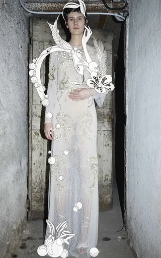 Female model wearing sheer floral evening gown by Nadia Flower