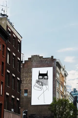Abstract cat mural on building wall by Nadia Flower