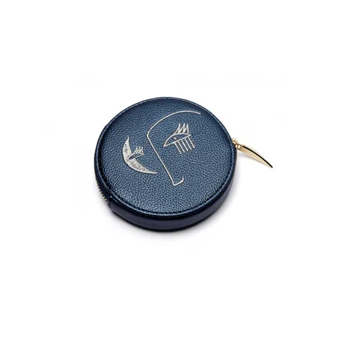 Round navy blue leather coin purse with white designs by Nadia Flower