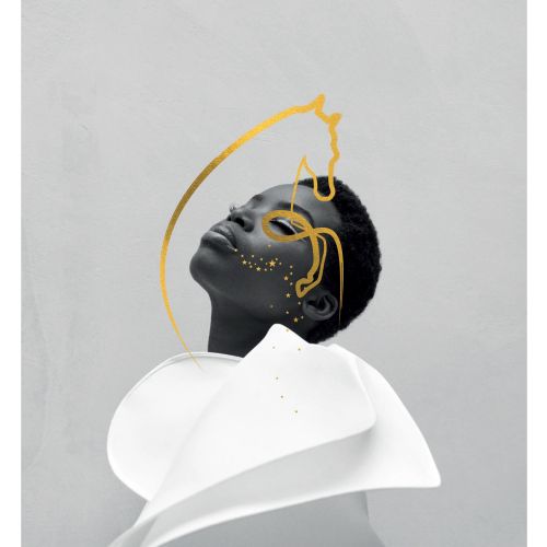 Portrait of person with abstract gold line art on face and white collar