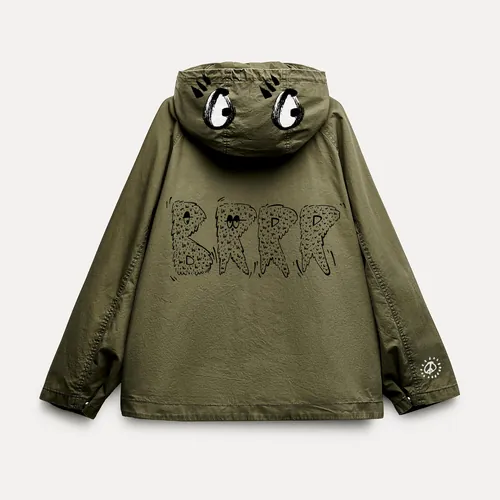 Green jacket with eyes on hood and Brrr text on back