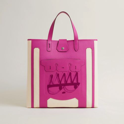 Pink and white tote handbag with front pocket and snap closure