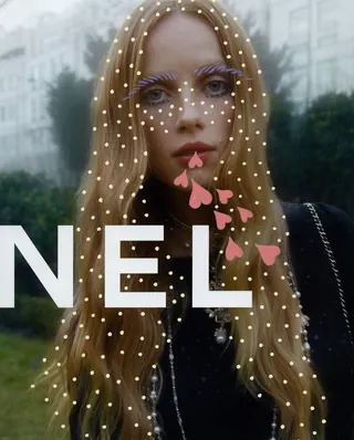 Portrait of woman with long hair and artistic dots on face