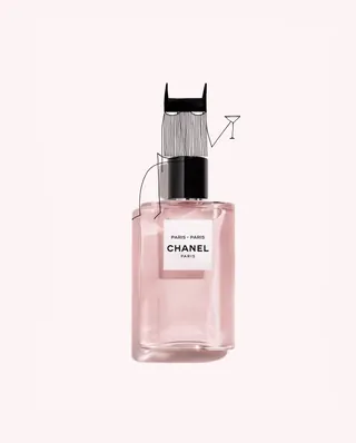 Chanel perfume bottle with illustrated cat wearing mask holding martini glass