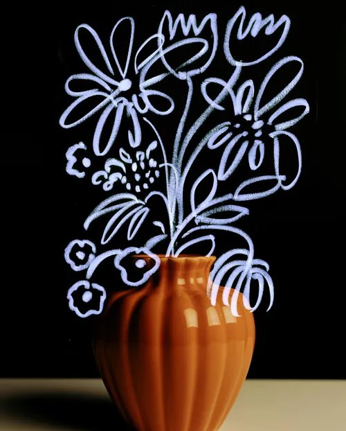 Orange vase with white line-drawn flowers on black background by Nadia Flower