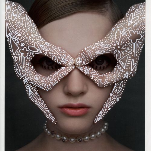 Portrait of woman with Dior face mask and pearl necklace by Nadia Flower