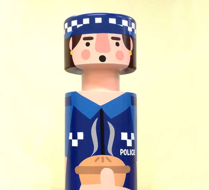 Colorful Painting of Airport Police on Bollards