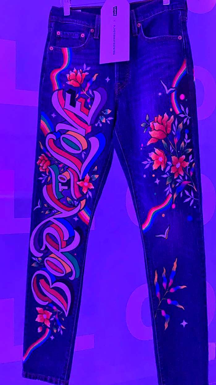 calligraphy on jeans supporting lgbtq