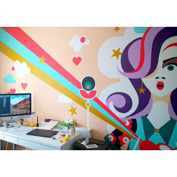cute girl mural near a work station