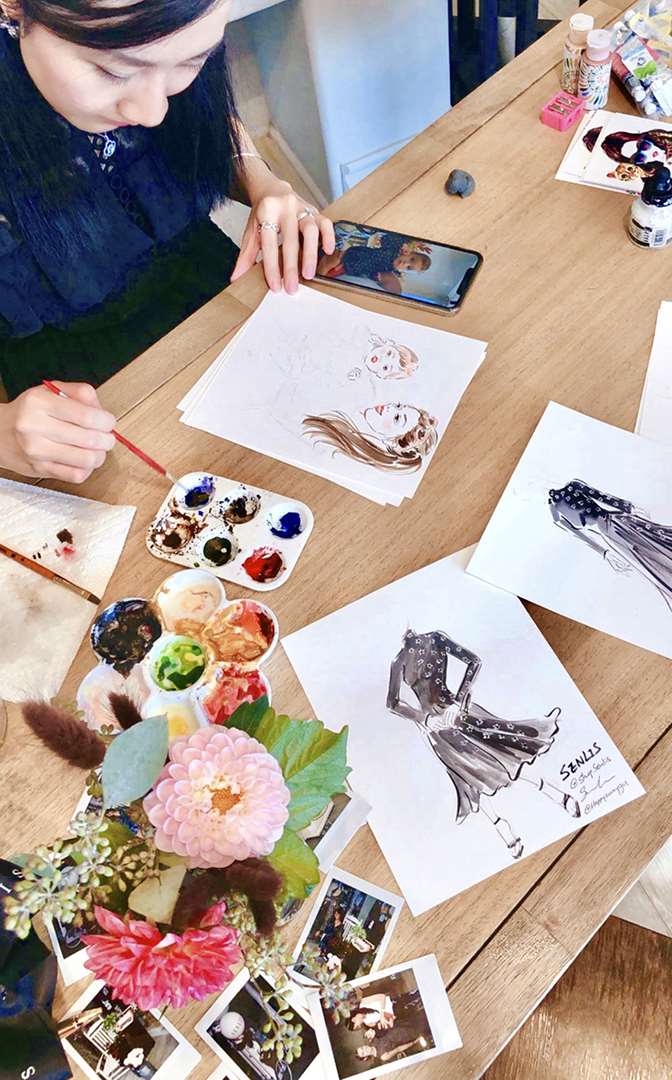 sunny gu drawing portraits at event