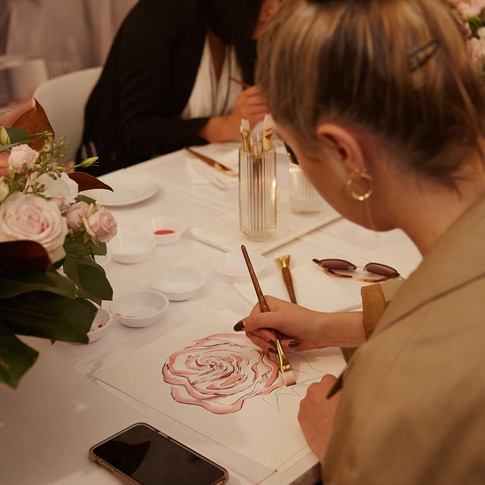 Woman drawing for Chloe's L'eau