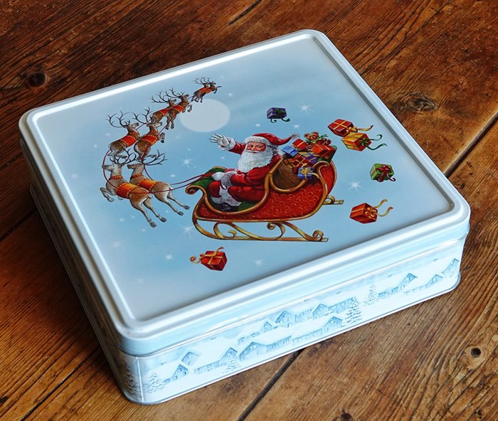 santa themed tin packaging classic painting