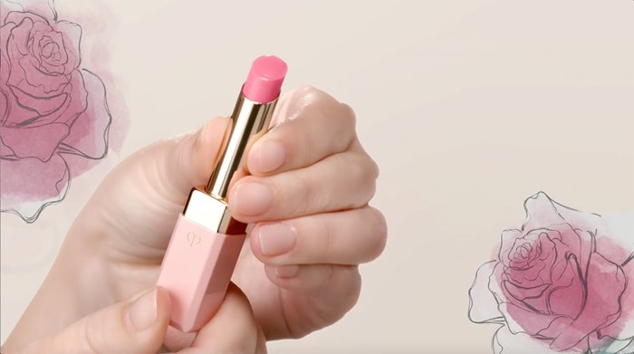 Hand holding lipstick illustration