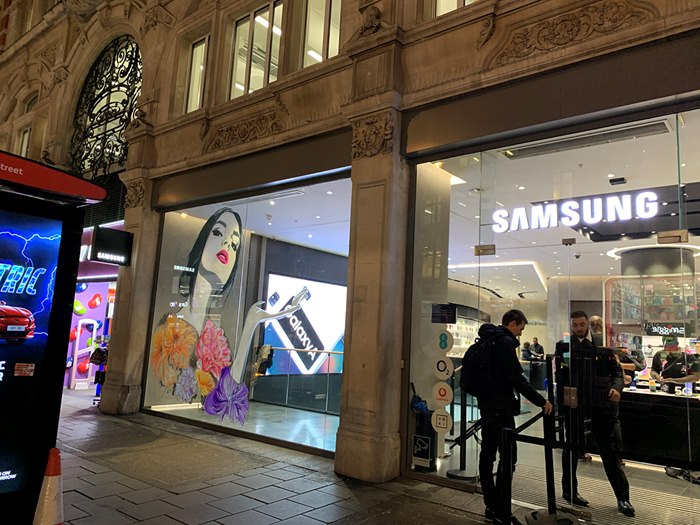 Illustration of Jessica Durrant on the window of Samsung's store