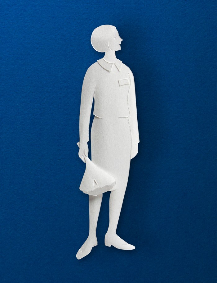 A paper sculpture of a hotel receptionist