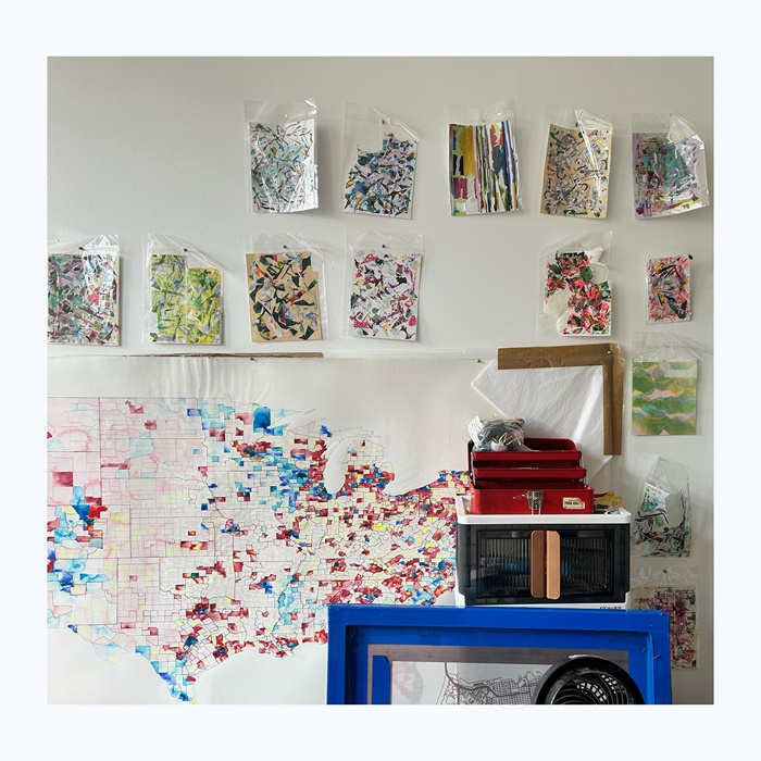 Jennifer's paintings stick on the wall